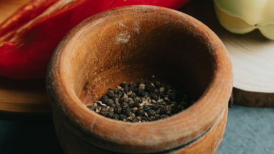 Black Kampot Pepper in wooden bowl